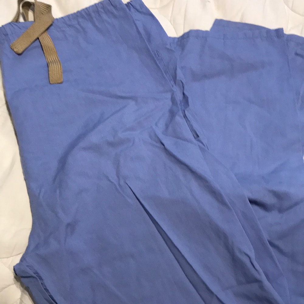Blue scrub pants.